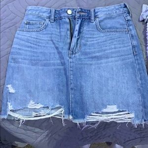 Jean skirt with a few rips in it